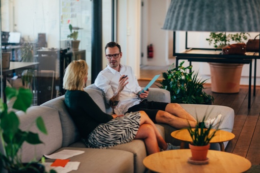 two people in a meeting and trendy surroundings